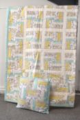 A handmade patchwork quilt and matching throw cushion, in pleasant pastel hues to include mint,