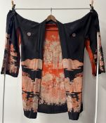 A 1940s Japanese kimono in black with red landscape motif across the back, lined in red silk with