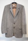 A vintage mens Dunn & Co. Harris Tweed jacket, in woven taupe, golden brown and cream 100% wool,