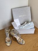A pair of Jimmy Choo wedding shoes in all-over silver glitter with silver leather footbed,