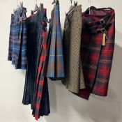 Five woolen kilt-style skirts in various tartans, to include Pure New Wool, and Boden, womens
