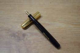 A Mabie Todd & Co Blackbird 5260 lever fill fountain pen in Black with Gold lined cap having