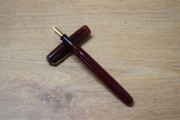 A Waterman 502 lever fill fountain pen in Burgundy with single cap band having Watermans 14CT