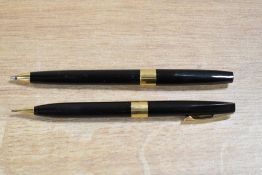 A Sheaffer ballpoint pen and pencil in Black with broad cap band
