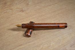 A Stellor eyedropper fill retractable nib fountain pen in Red and Black ripple having Warranted 18CT