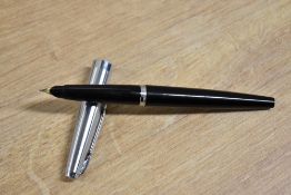 A boxed Parker 45 plunger fill fountain pen in Black with chrome cap