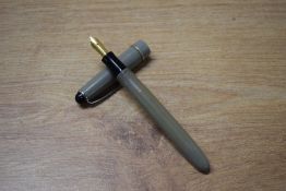 An Osmiroid 65 lever fill fountain pen in Grey with single cap band having Osmiroid Italic Broad