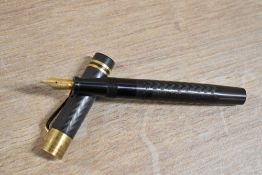 A Stellor No502 lever fill fountain pen in Black Hard Rubber with two cap bands and gold topped