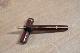 An Eagle Pencil Co USA lever fill fountain pen in Red and Black woodgrain with single band flat
