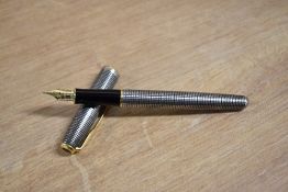 A boxed Parker Sonnet converter fill fountain pen in 925 silver Cicele with gold trim having