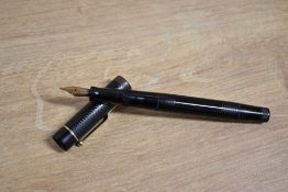 A boxed Mabie Todd & Co Swan L2 Self Filler Twist fill fountain pen in Black Hard Rubber having a