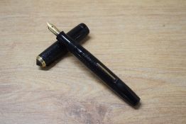 A National Security lever fill fountain pen in Black engine turned design with single narrow cap