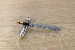 A Fily Motors? Lever fill fountain pen in Grey marble with two cap bands to a ring top cap having