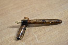 A Unique lever fill fountain pen in Brown hatching with three narrow cap bands having Warranted
