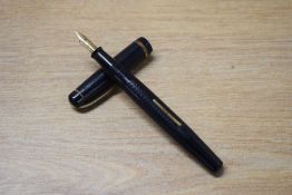 A Summit lever fill fountain pen in Black engine turned design with single narrow cap band having