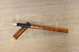 A boxed Ronson converter fill fountain pen in laque brown