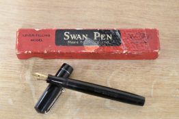 A boxed Mabie Todd & Co Swan lever fill fountain pen in Black with narrow cap band having a Swan 2