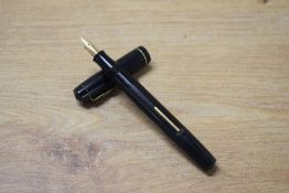A National Security No222 lever fill fountain pen in Black engine turned design with single narrow