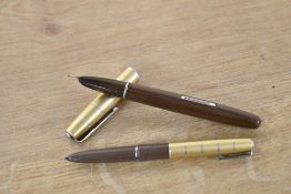 A boxed Waterman Taperite Crusader lever fill fountain pen and fibre tip pen in Tan with Goldtone