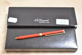 A boxed ST Dupont ballpoint pen in Laque de Chine with gold trim. With booklet and card