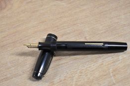 A Stephens No106 lever fill fountain pen in engine turned Black Hard Rubber with a narrow cap band