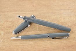 A boxed Platignum lever fill fountain pen and pencil set in Grey