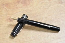 A vintage Kingswood lever fill fountain pen in Black with filigree cap band having Warranted 14CT