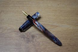 An Osmiroid 65 lever fill fountain pen in multi colour marble with single cap ban having Osmiroid