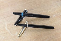 Two fountain pens. A Universal cartridge fill fountain pen in Black and a Mu-Neca aero fill (