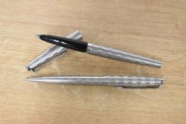 A boxed Parker 45 Harlequin converter fill fountain pen and pencil set in the shield pattern