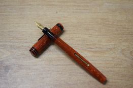 A Mabie Todd & Co Swan 148 53 self filler lever fill fountain pen in Scarlet with one black cap band