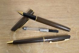 A boxed Waterman Concorde converter fill fountain pen and ballpoint pen in Brown with Gold trim