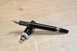 A Montblanc Starwalker cartridge fill fountain pen in Black with platinum trim having having