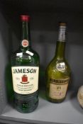 Two large vintage spirit bottles, both empty, comprising a J&F Martell VS Cognac and a Jameson Irish