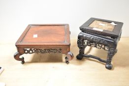 Two 20th-century Oriental-style hardwood display stands/pedestals, both featuring ornate scroll
