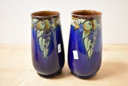 Two early 20th-century Royal Doulton Lambeth stoneware vases, featuring tube-lined decoration of