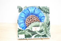 A 19th-century William De Morgan (1839-1917) tin-glazed earthernware 'BBB' cornflower tile,