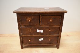A late 19th-century hardwood table-top chest of drawers, thought to be an apprentice piece,