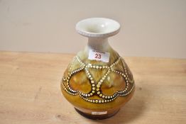 An early 20th-century Art Deco Royal Doulton Lambeth stoneware vase, featuring a narrow neck flaring