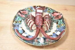 A large mid 20th-century Portuguese Palissy-style Majolica decorative wall plate, featuring a deep