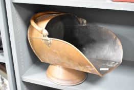 A large late 19th to early 20th-century copper coal scuttle, featuring the popular helmet shape,
