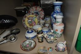 A selection of 20th-century Oriental ceramics, featuring a quantity of decorative plates with