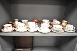 A quantity of 19th-century porcelain teacups and saucers, to include a French Limoges Tressemanes