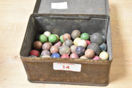 A quantity of mid to late 19th-century clay marbles, of varying colours and sizes, to include one
