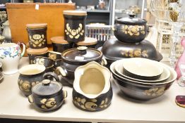 A selection of Denby Bakewell pattern kitchen wares, to include lidded storage jars, casserole dish,