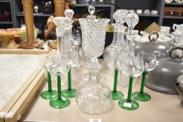 A group of nine 20th century glass and cut glass decanters, largest measuring 32cm tall, sold