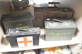 A group of four vintage ammunition boxes, largest measuring 40cm x 22cm x 11cm.