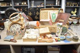 A group of vintage sewing and needlework related items, including threads, buttons, pin cushions,