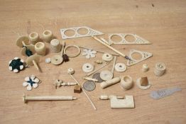 A quantity of early 20th-century hand carved animal bone sewing notions, to include a thimble,