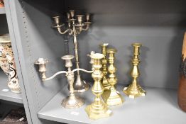 A quantity of 19th to 20th-century metal candlesticks, to include a pair of 'beehive' polished brass